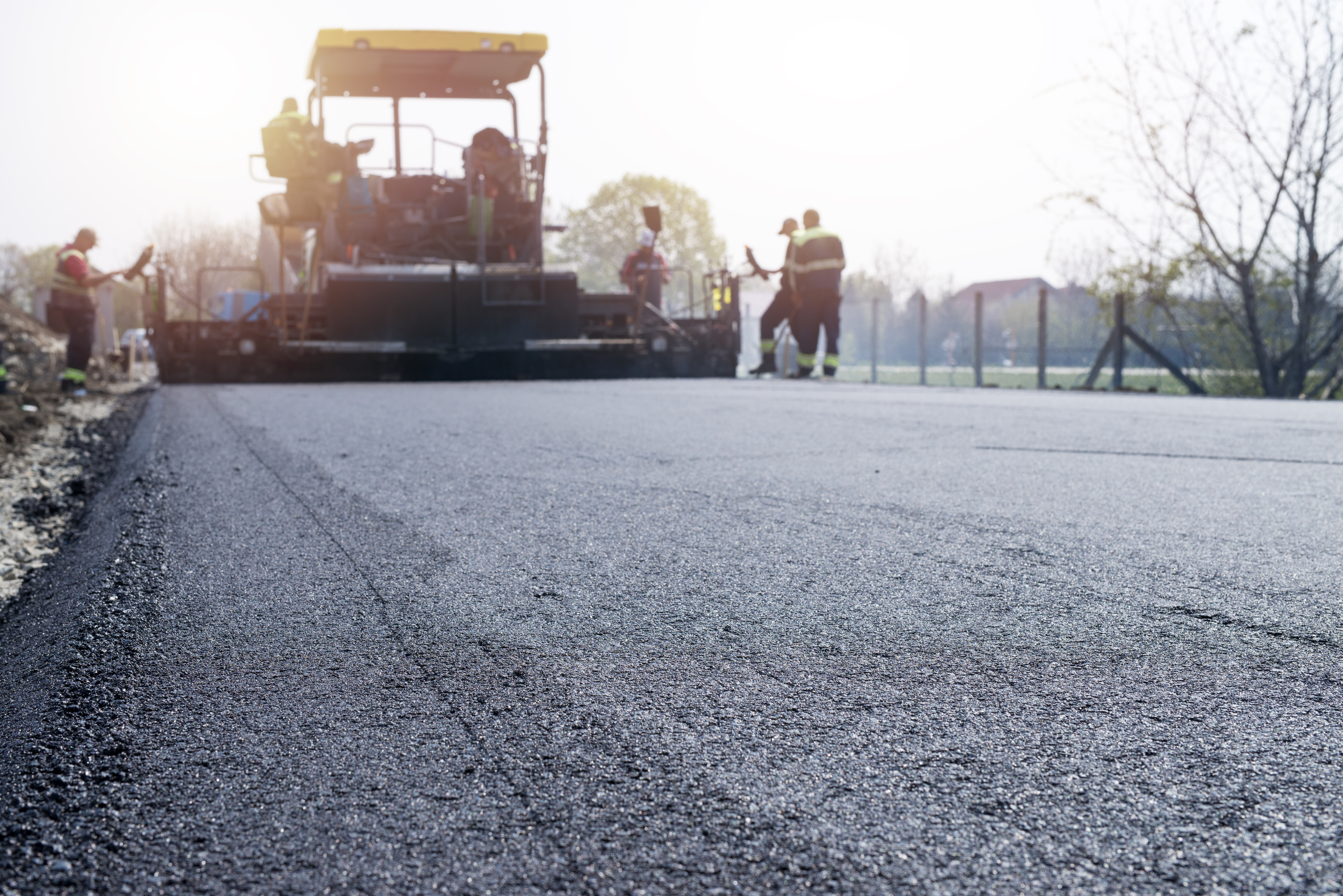 Residential asphalt driveway paving project in progress
